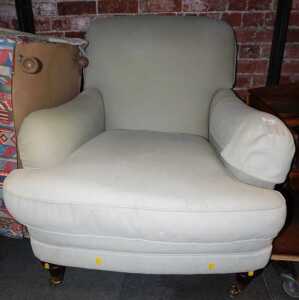 A contemporary armchair in Howard and Sons style, upholstered in duck egg blue fabric, on turned...