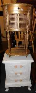 A French style gilt painted bedside table, with cane work decoration, together with a white...