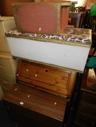 A pine bureau, 28cm high, 83cm wide, together with a Lloyd Loom style ottoman, Lloyd Loom style...