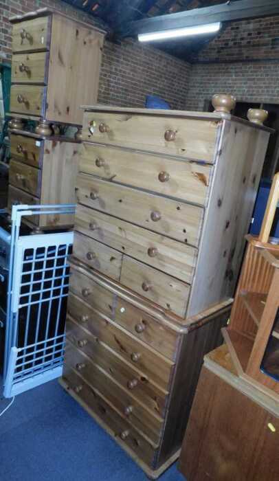 A group of pine bedroom furniture, comprising a pair of three drawer bedside chests, further...