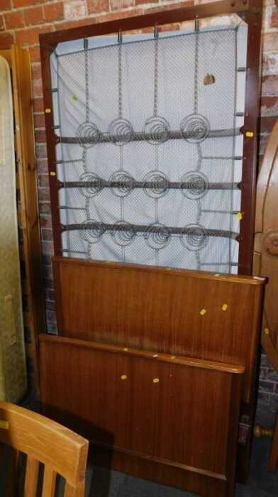 A teak single bed, comprising headboard and footboard, together with a bed base and single...
