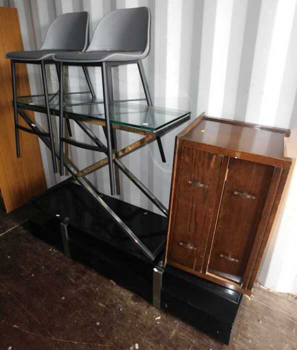 A black glass television stand, together with a glass top side table, on metal X frame base,...