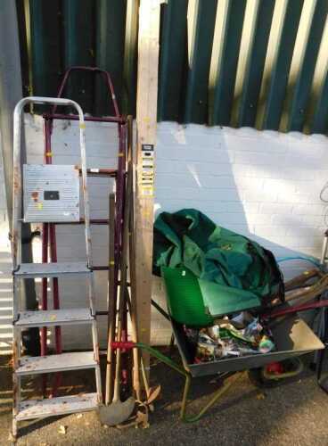 Three stepladders, together with various garden tools, a wheelbarrow, and a plastic watering can,...