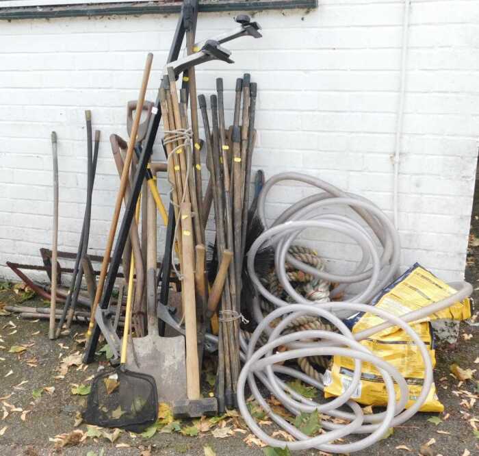 Various garden tools, including shovels, rose sprayers, forks, a mallet, bolt cutters, rope, etc....