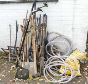 Various garden tools, including shovels, rose sprayers, forks, a mallet, bolt cutters, rope, etc....