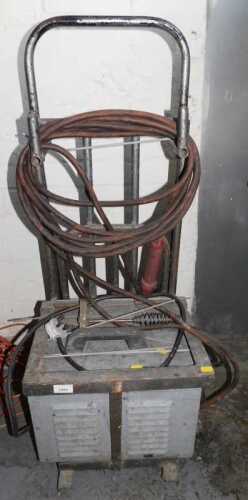 An arc welder, on a sack barrow.