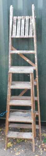 Two wooden A frame ladders.