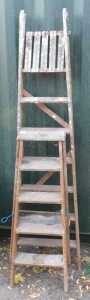 Two wooden A frame ladders.