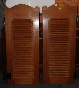 A pair of teak saloon doors, with louvred fronts, 131cm high, each 52cm wide.
