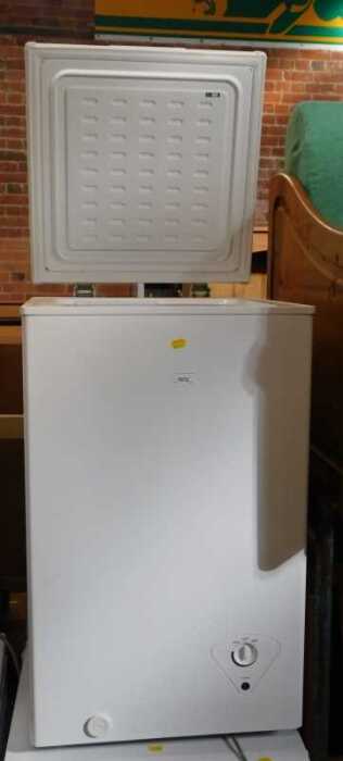 An Essentials chest freezer, model C61CF13.