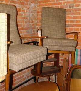 Two oak framed chairs, with tartan upholstered seats and back.