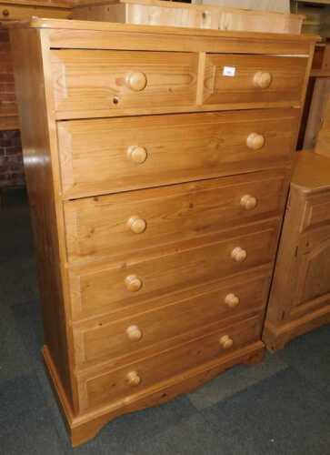 A pine chest, of two short over five long drawers, raised on bracket feet, 134cm high, 87cm wide,...