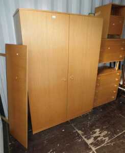 A 1970s Avalon teak bedroom suite, comprising double wardrobe, headboard, chest of four drawers,...