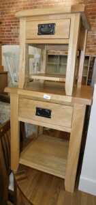 A contemporary oak side table, with single frieze drawer above an under tier, 60cm high, and...