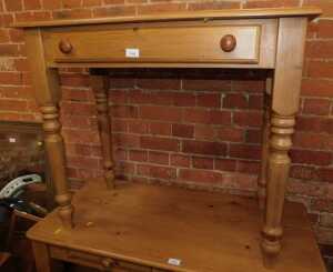 A contemporary pine side table, with single frieze drawer, raised on turned legs, 75cm high,...