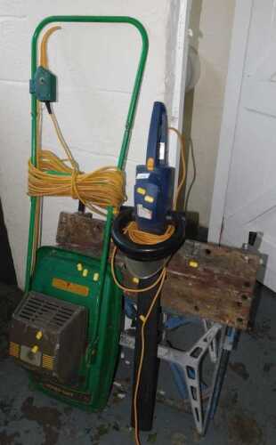 A Pro electric hedge trimmer, together with a Hover Safe electric lawn mower, and a workmate.