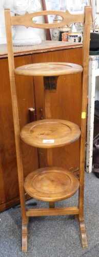 A mahogany three tier cake stand.
