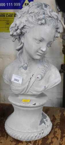 A modern composition bust of young lady, on a tapering socle, 43cm high.