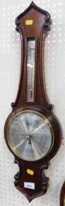 A mahogany aneroid barometer by Comitti of London, 68cm high.