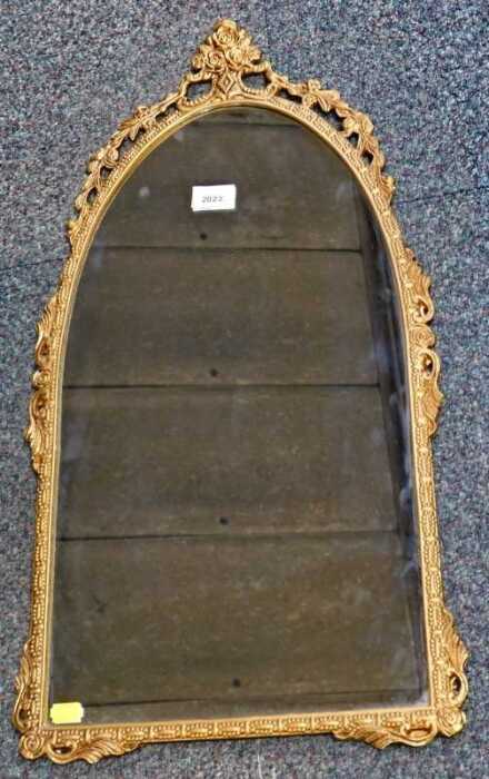 A gilt metal arched wall mirror, 70cm high.