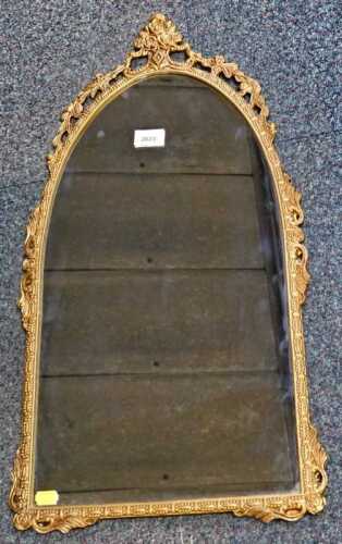 A gilt metal arched wall mirror, 70cm high.