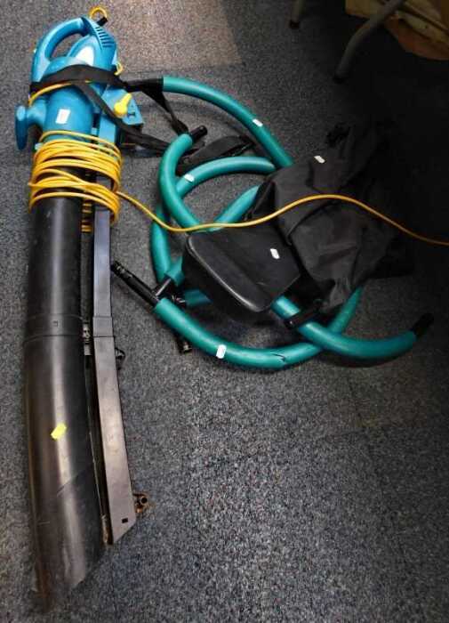 A garden blower vacuum and an exercise machine. (2)
