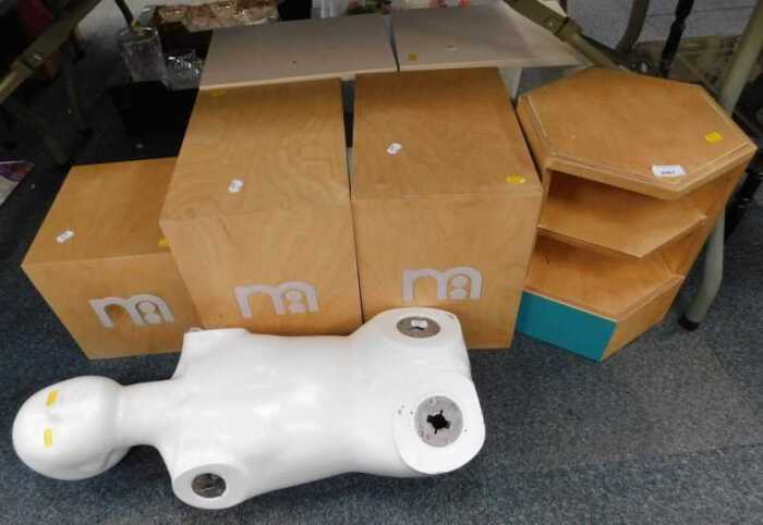 A quantity of Mothercare shop stands, and a partial mannequin.