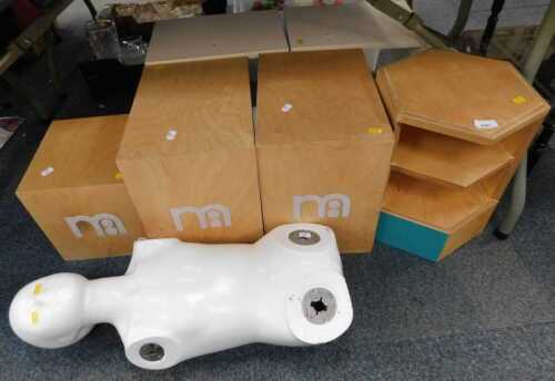 A quantity of Mothercare shop stands, and a partial mannequin.