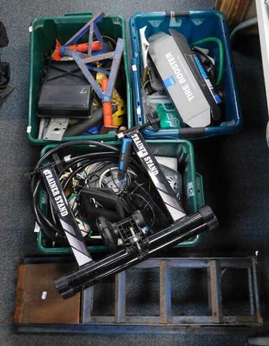Various tools, including a hosepipe, a Piranha stapler, etc, and a bicycle trainer. (a quantity)...