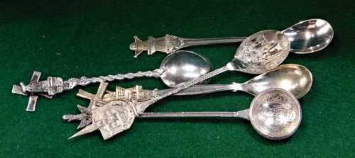 A group of white metal spoons, to include three Dutch examples, each terminal decorated with a...