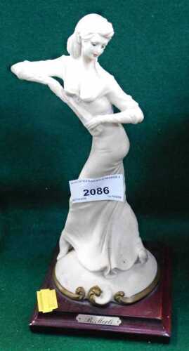A B. Merli resin figure of a lady, on a square base, 23cm high.
