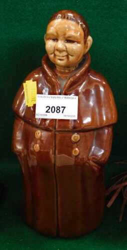 A German ceramic spirit flask, modelled in the form of a monk, 23cm high.