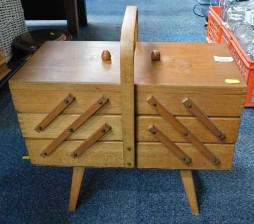 A beech folding jewellery box, on tapering legs.