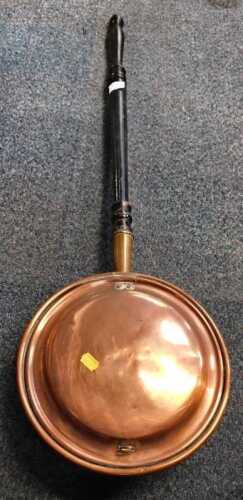 A 19thC copper and brass warming pan, with turned ebonised handle.