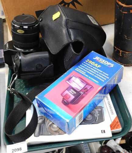 A Canon EOS 650 SLR camera, cased, together with a Jessops 280AF flash, and various instruction...