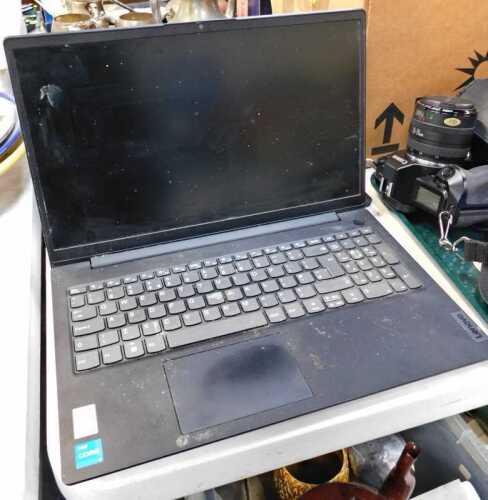 A Lenovo 15.5" laptop, model name Lenovo V15G3IAP, with hard drive removed.