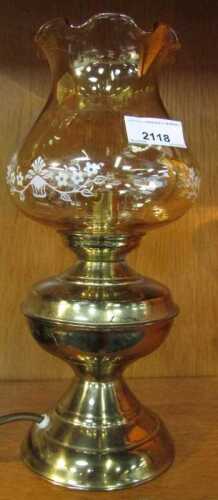 A brass lamp, modelled as an oil lamp.