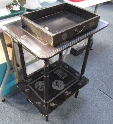 A Japanned two tier table, with frieze drawer to the top, 75cm high, 50cm wide, 37cm deep. (AF)