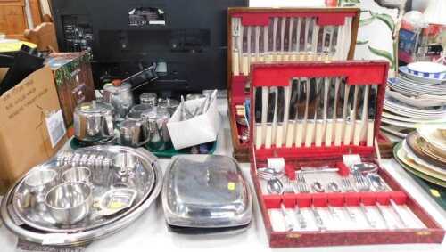 Two cased canteens of cutlery, together with stainless steel wares to include trays, toast racks,...