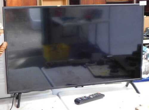 A Samsung 31" television, with lead and remote.