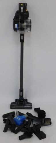 A Vax cordless vacuum cleaner, with attachments.