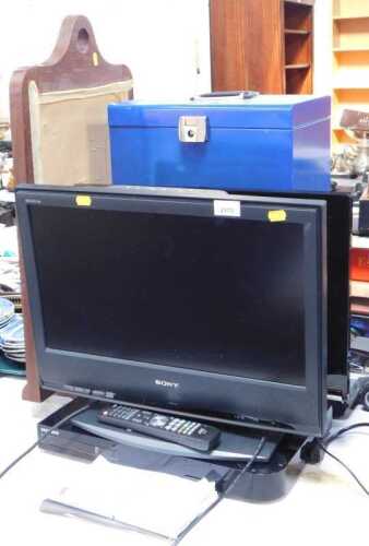A Sony 20" television, together with a JVC DVD player, oak fire screen, and two document cases.