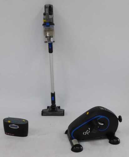 A Vax Pace cordless vacuum cleaner, together with a Roberts radio, and a foot pedal machine.