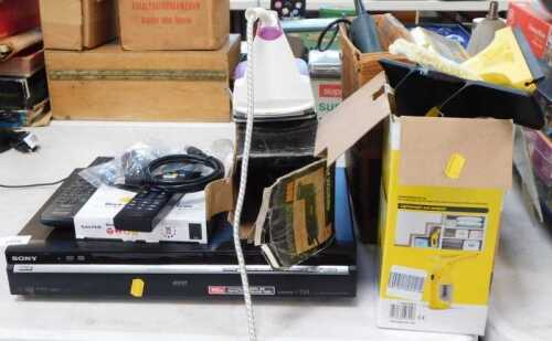 A Sony high-definition DVD player, together with a Karcher cordless window vac, heat gun, iron,...