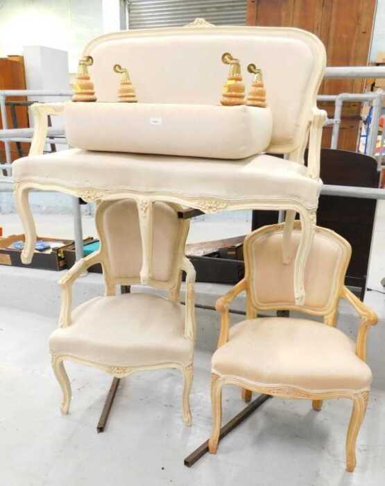 A four piece salon suite, comprising French style two seater settee and two armchairs, with...