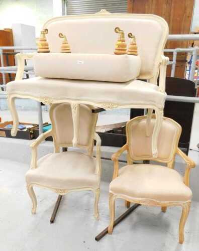 A four piece salon suite, comprising French style two seater settee and two armchairs, with...