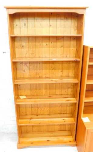 A pine open bookcase, of six shelves.