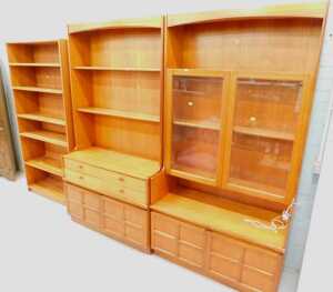 A Nathan teak display unit, comprising open shelves and glazed shelves in two sections, and a...