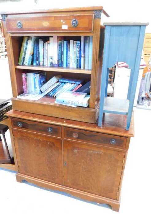 A yew wood finish open bookcase, with single drawer above open shelves, with a quantity of books,...