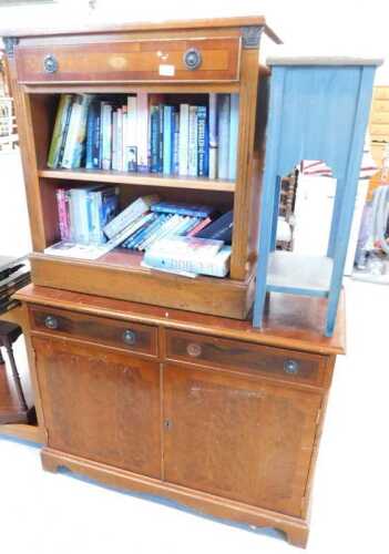 A yew wood finish open bookcase, with single drawer above open shelves, with a quantity of books,...